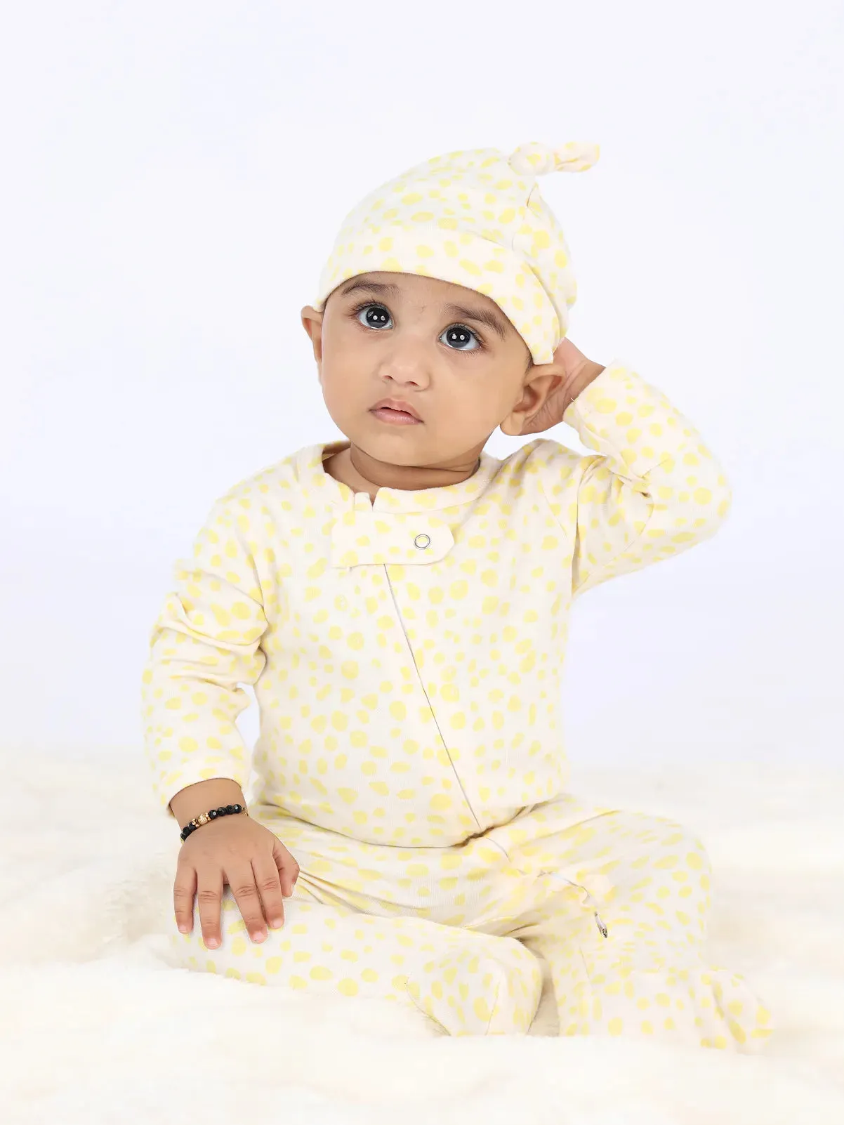 Full sleeve yellow patterns in white zipper sleepsuit with cap for baby